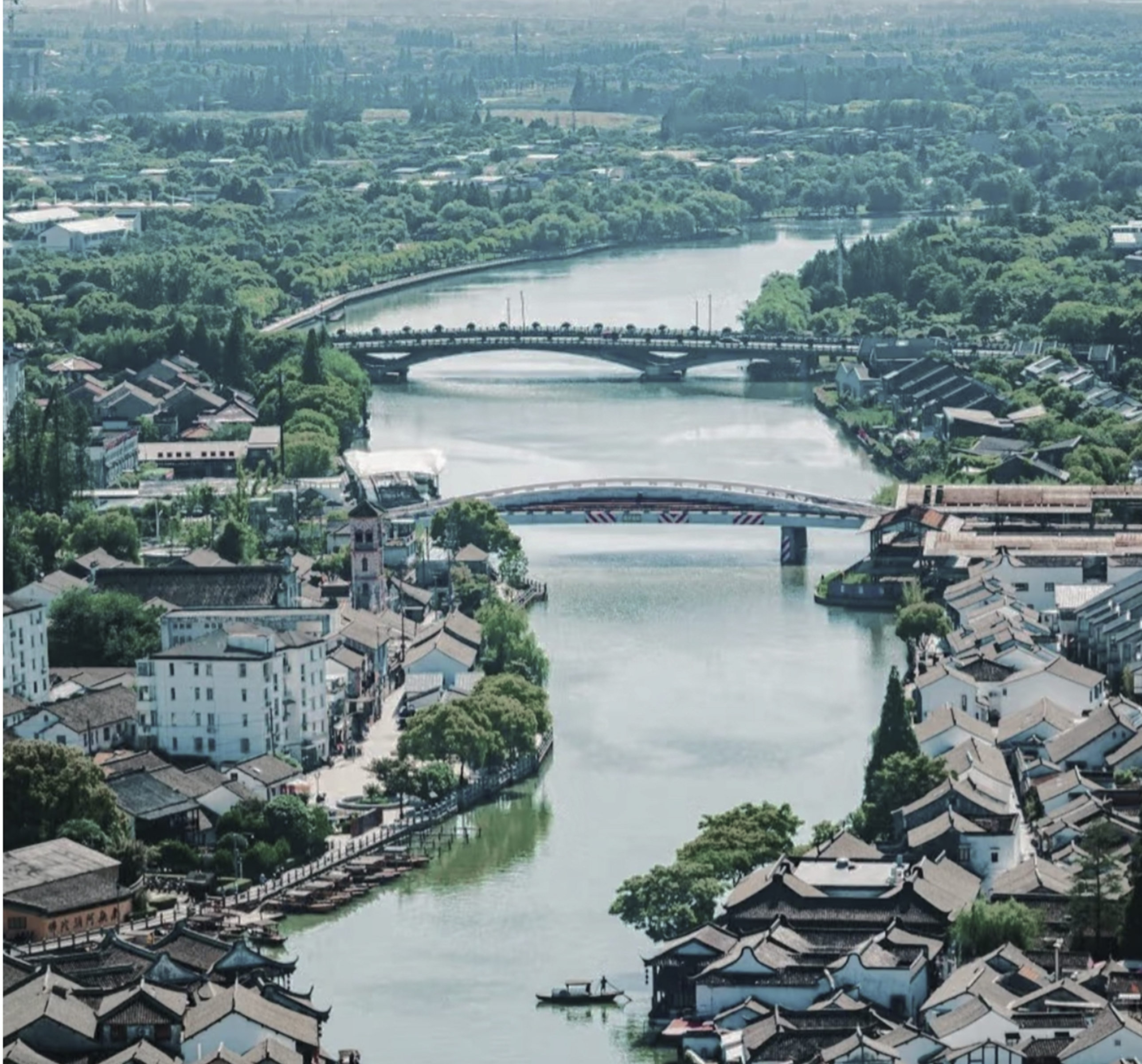 Aerial view showing Zhujiajiao's waterways, bridges, and historic town layout.